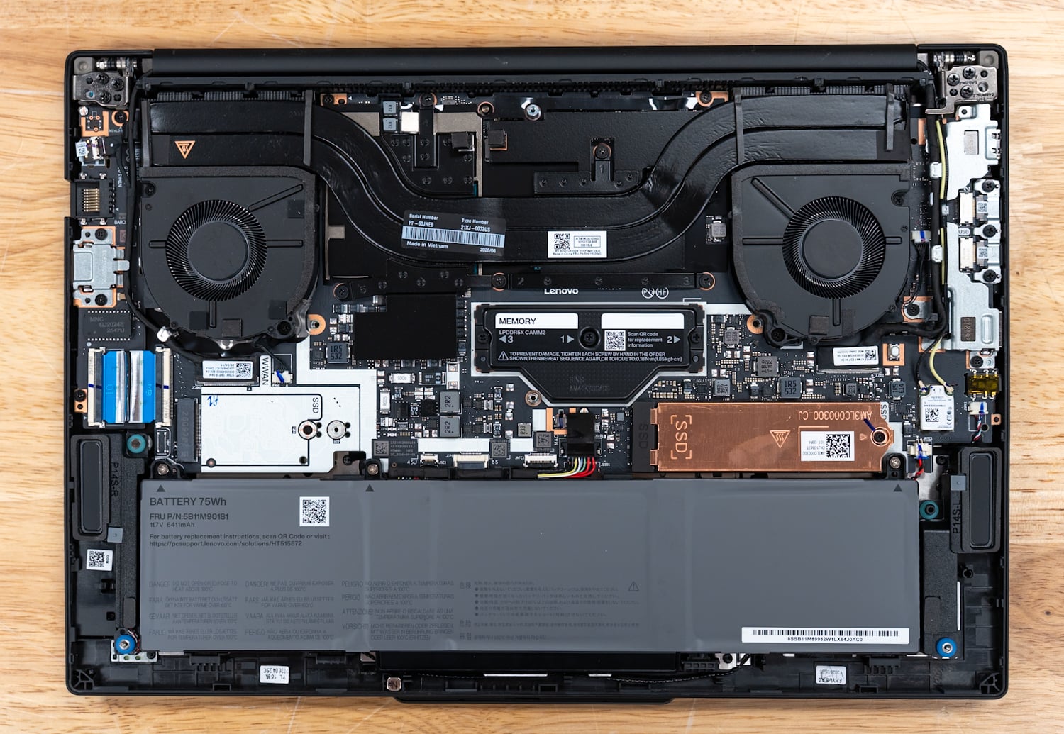 Lenovo ThinkPad P14s Gen 7 internals showing the 75Wh battery, Gen5 SSD, and cooling for the RTX PRO 1000