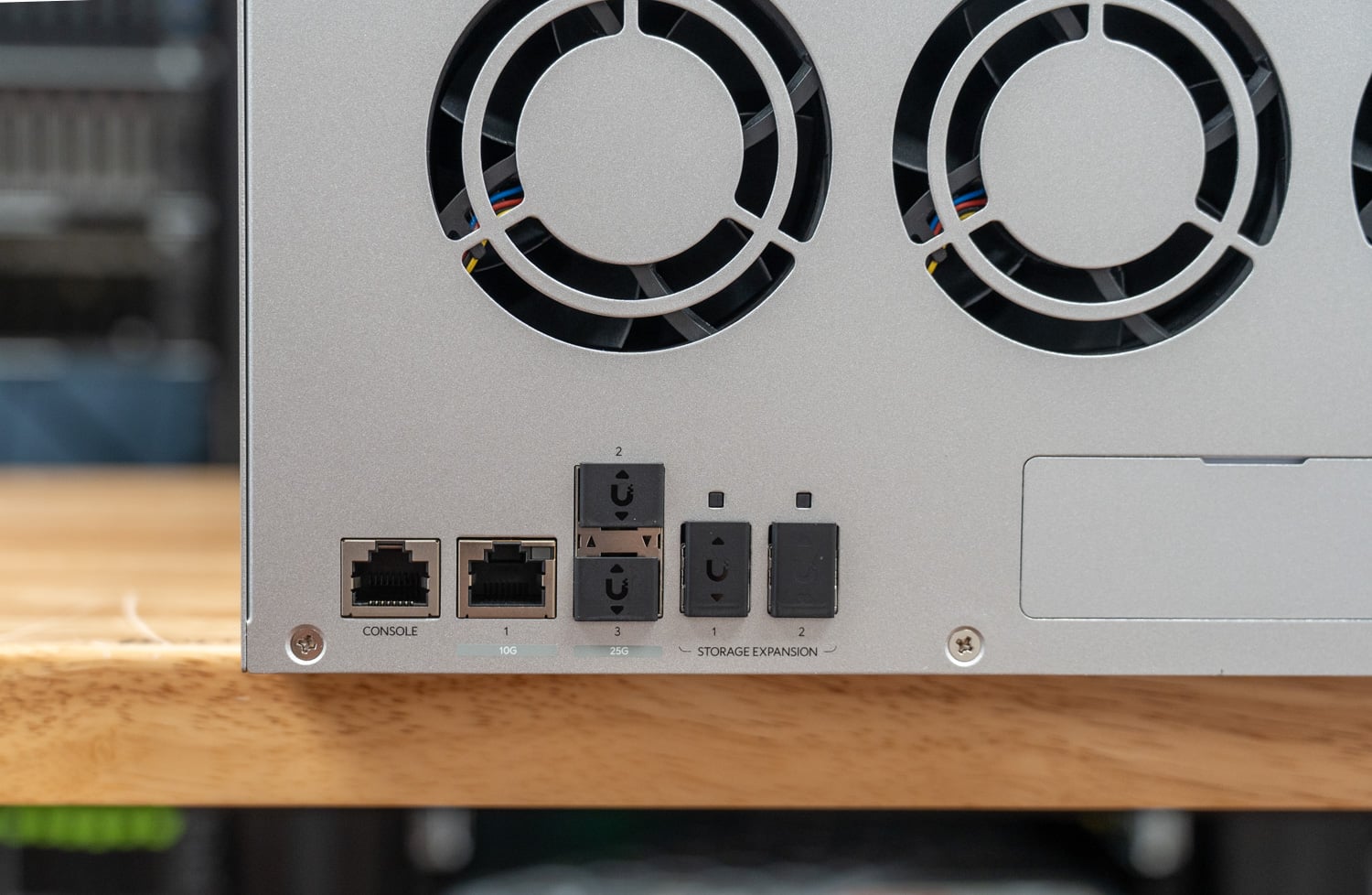 Rear of the Ubiquiti Enterprise NAS with console port, dual 25GbE SFP28, and SFF-8644 expansion ports