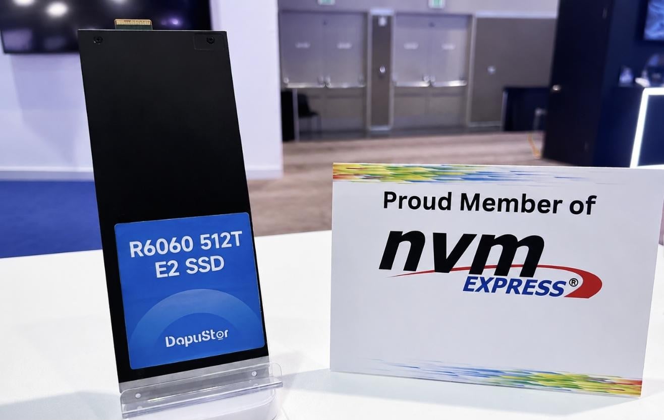 DapuStor 512TB R6060 E2 SSD standing on the FMS 2026 booth beside an NVM Express member sign