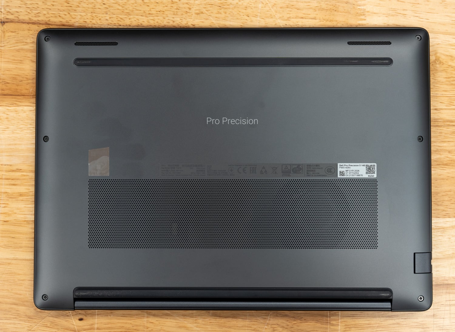 Dell Pro Precision 5 14s AMD underside with Pro Precision branding and intake grille