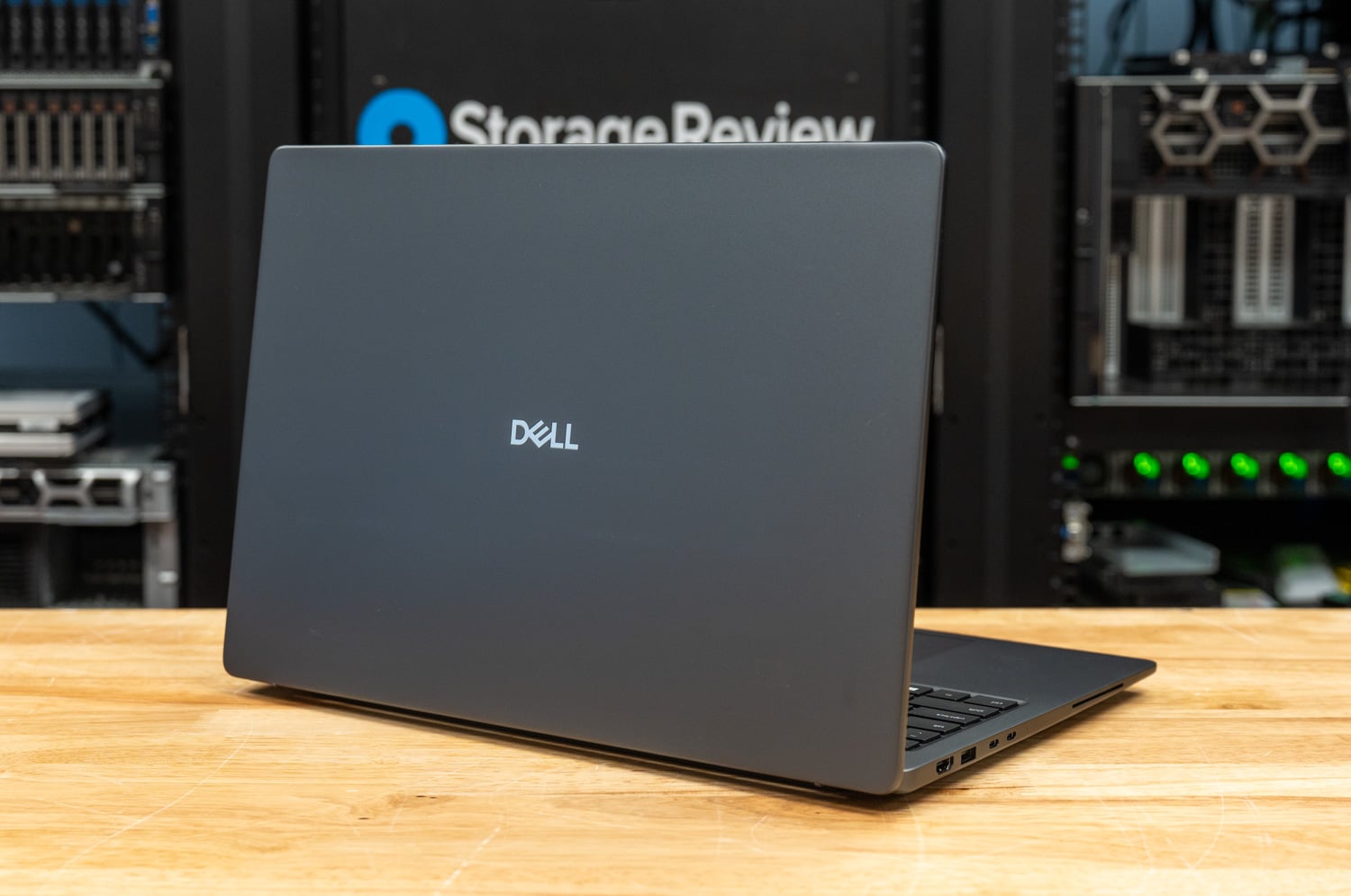 Dell Pro Precision 5 16s AMD from the rear three-quarter angle showing the hinge and exhaust