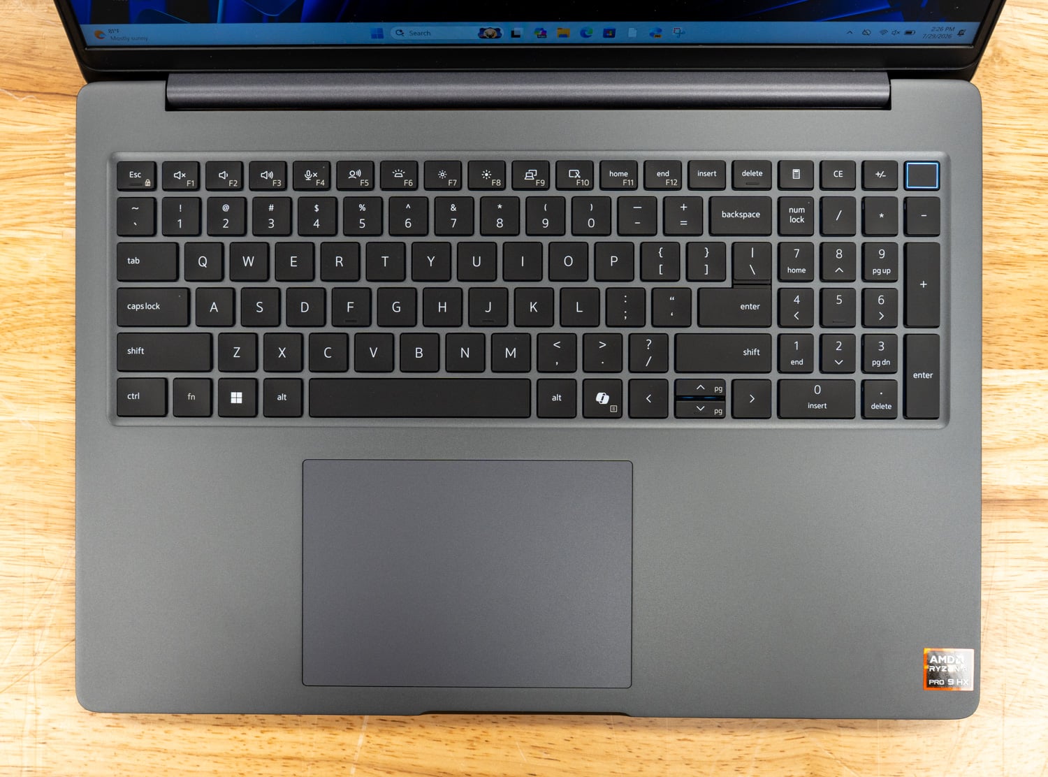 Dell Pro Precision 5 16s AMD keyboard deck from above showing the backlit keyboard with numeric keypad and glass touchpad