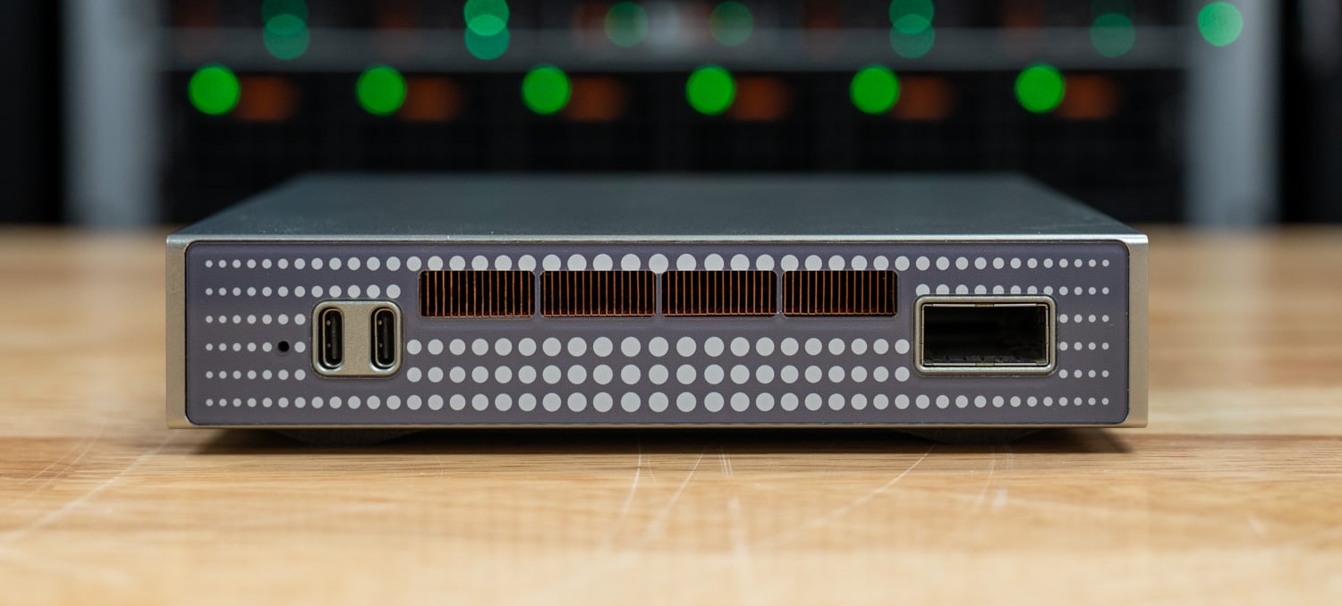GP Spark rear panel with two USB-C ports, copper heatsink fins behind the vents, and the QSFP28 100GbE cage
