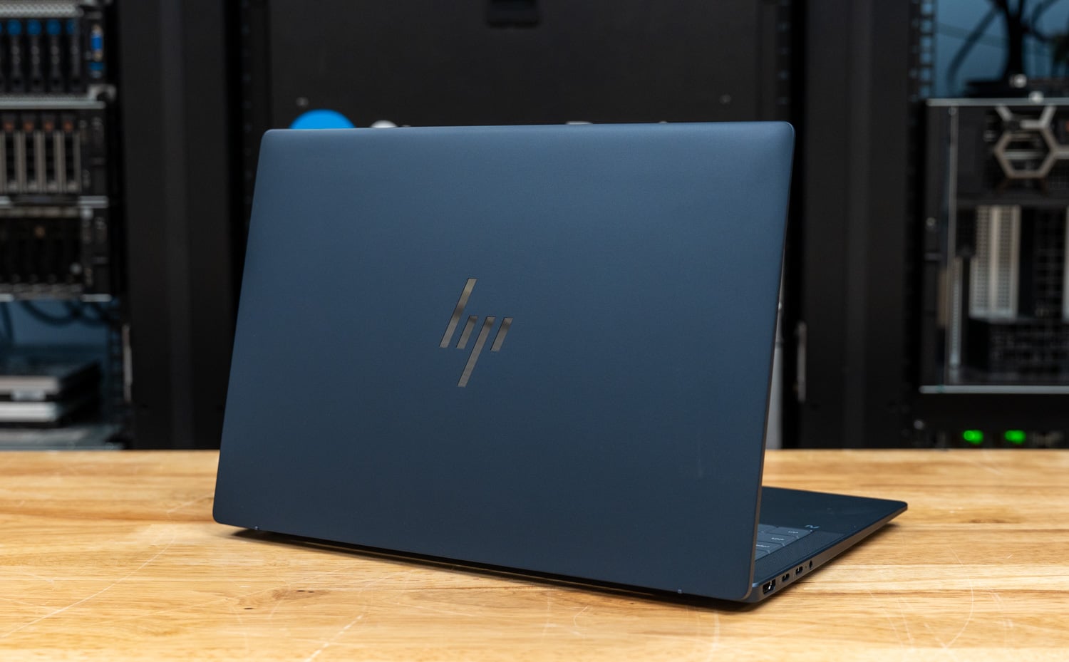 HP EliteBook X G2i in Atmospheric Blue, closed, three-quarter rear view showing the HP logo on the lid