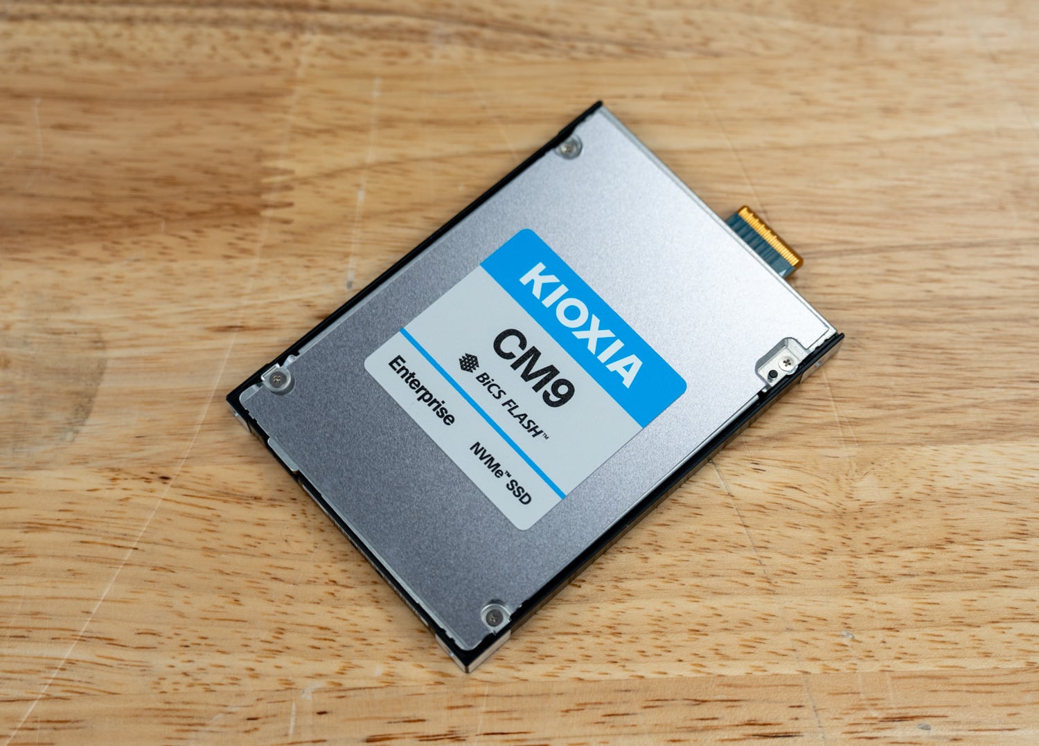 KIOXIA CM9-R E3.S SSD label side at an angle showing the EDSFF connector