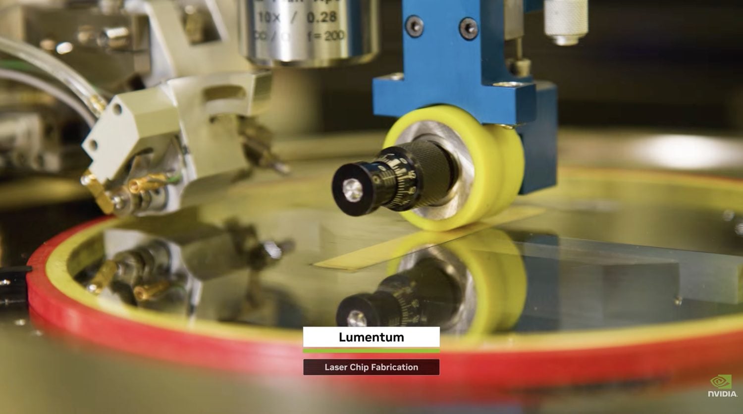 Laser chip fabrication at Lumentum, with a probe station over a wafer of laser dies for the Spectrum-X Photonics switch