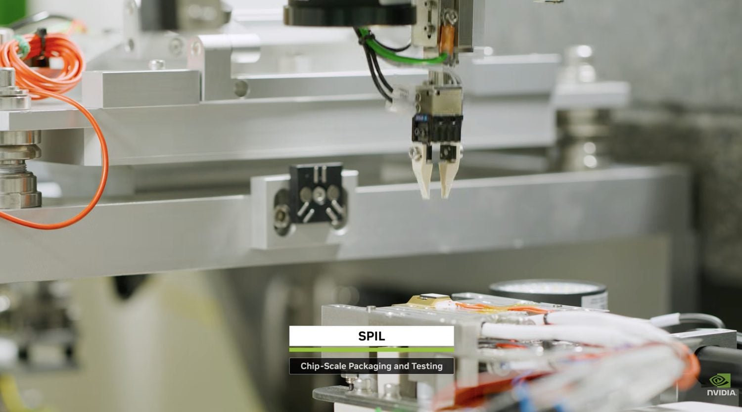 Chip-scale packaging and testing at SPIL, with a pick-and-place head over a Spectrum-X Ethernet Photonics optical assembly