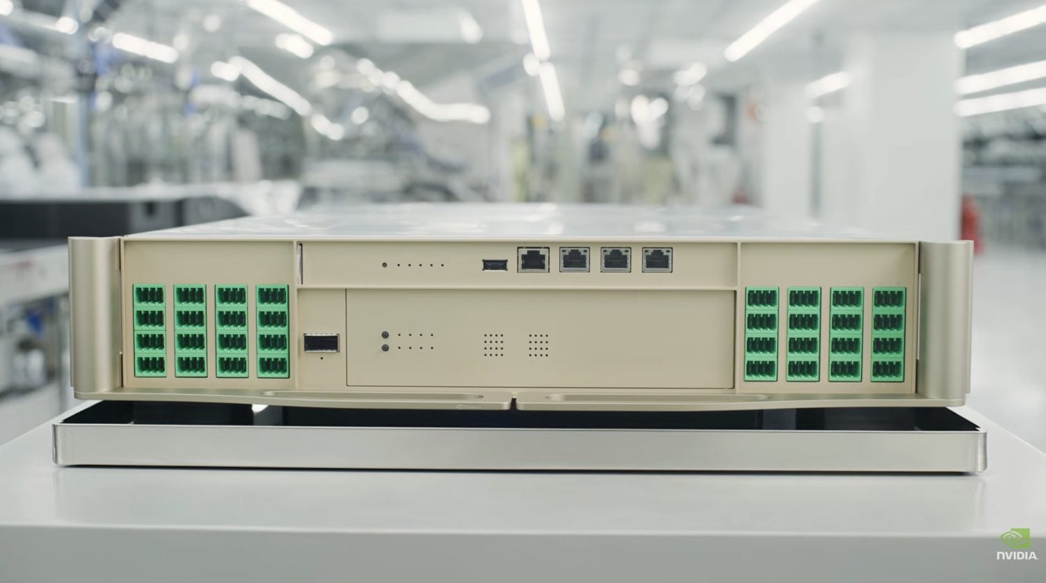 NVIDIA Spectrum-X Ethernet Photonics switch on a cleanroom bench, showing banks of green MPO fiber connectors flanking the management ports