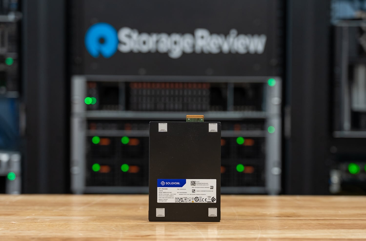 Solidigm D7-PS1030 12.8TB E3.S SSD standing upright in the StorageReview lab