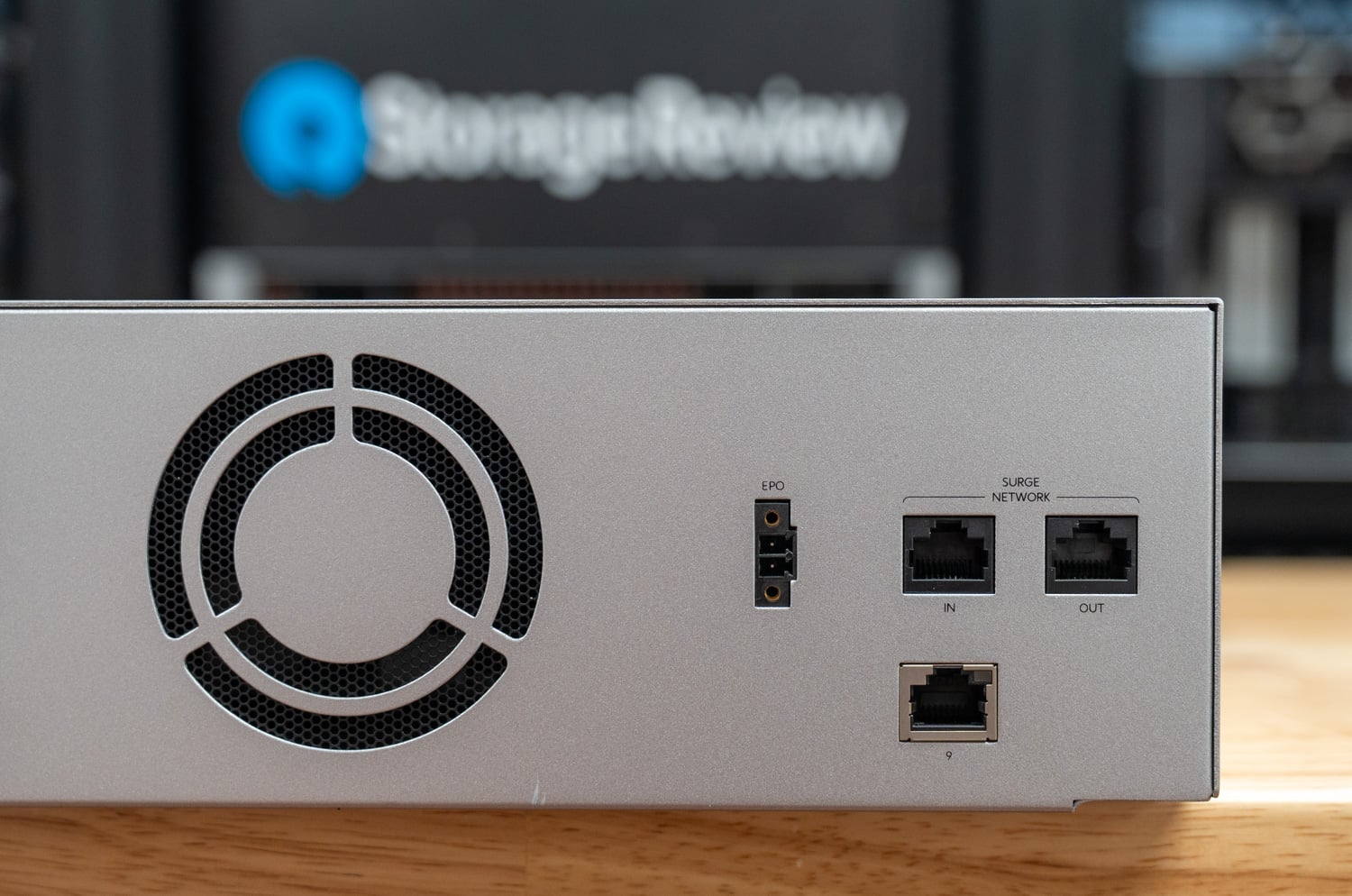 Close-up of the UPS 2U Pro rear EPO connector, surge network in and out ports, and management Ethernet port