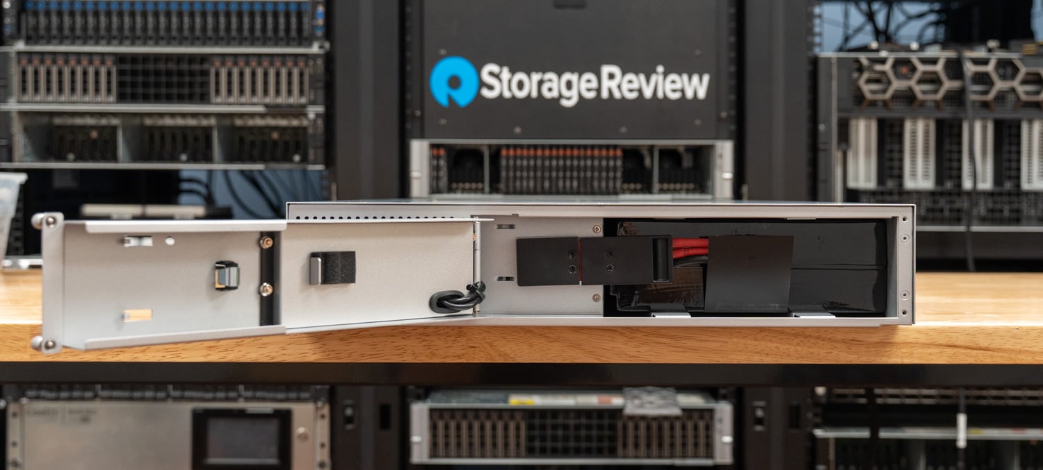 Front battery bay of the Ubiquiti UPS 2U Pro with the access door open