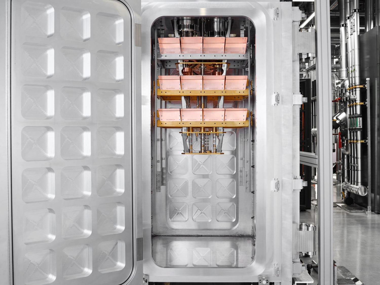 Gold-plated stages and dense wiring inside IBM’s modular cryogenic quantum system