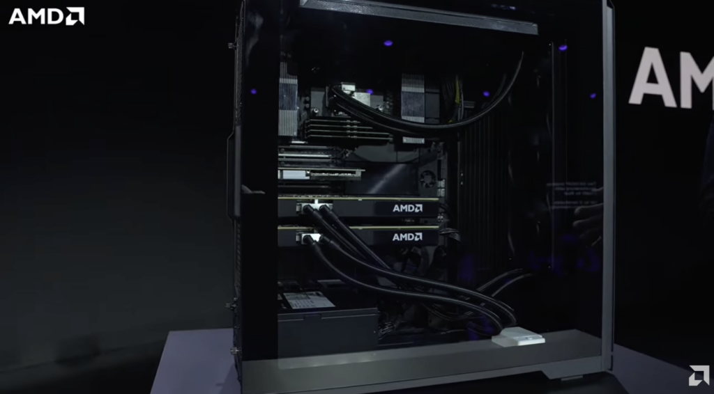AMD Threadripper Halo Station internals through the glass side panel, showing both MI350P cards and the CPU liquid cooling loop
