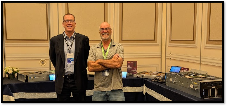 Lenovo server hardware on display at VMware Explore 2026 with two attendees beside the table