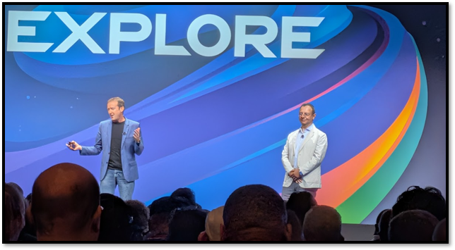 Two presenters on the VMware Explore 2026 keynote stage during the Standard Chartered factory-integrated rack segment