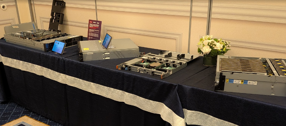 Row of open Lenovo server chassis and trays on a display table