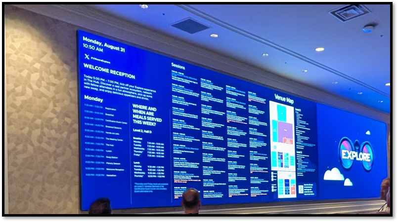 VMware Explore welcome reception schedule on a large conference display