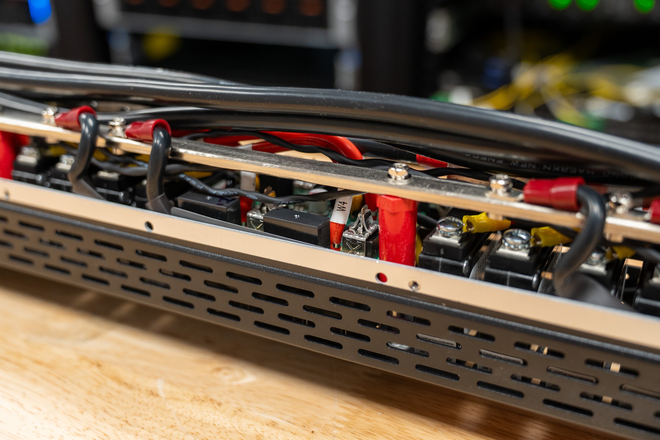 Inside the Eaton HDXL Rack PDU, heavy-gauge red and black conductors and bus bars feeding the branch breakers