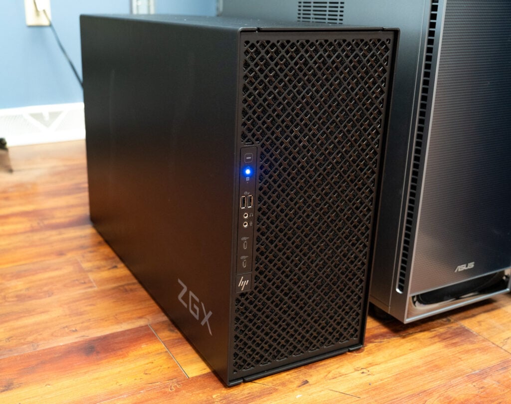 HP ZGX Fury AI station tower in the StorageReview lab, showing the front mesh panel, ZGX badge, and front USB and audio ports