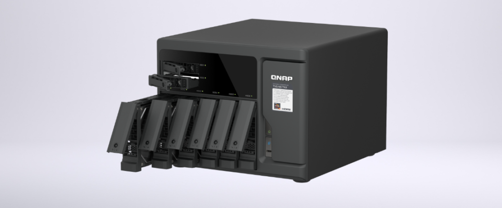 QNAP TVS-h877AX with its six SATA drive trays and two U.2 NVMe trays pulled partly out of the chassis