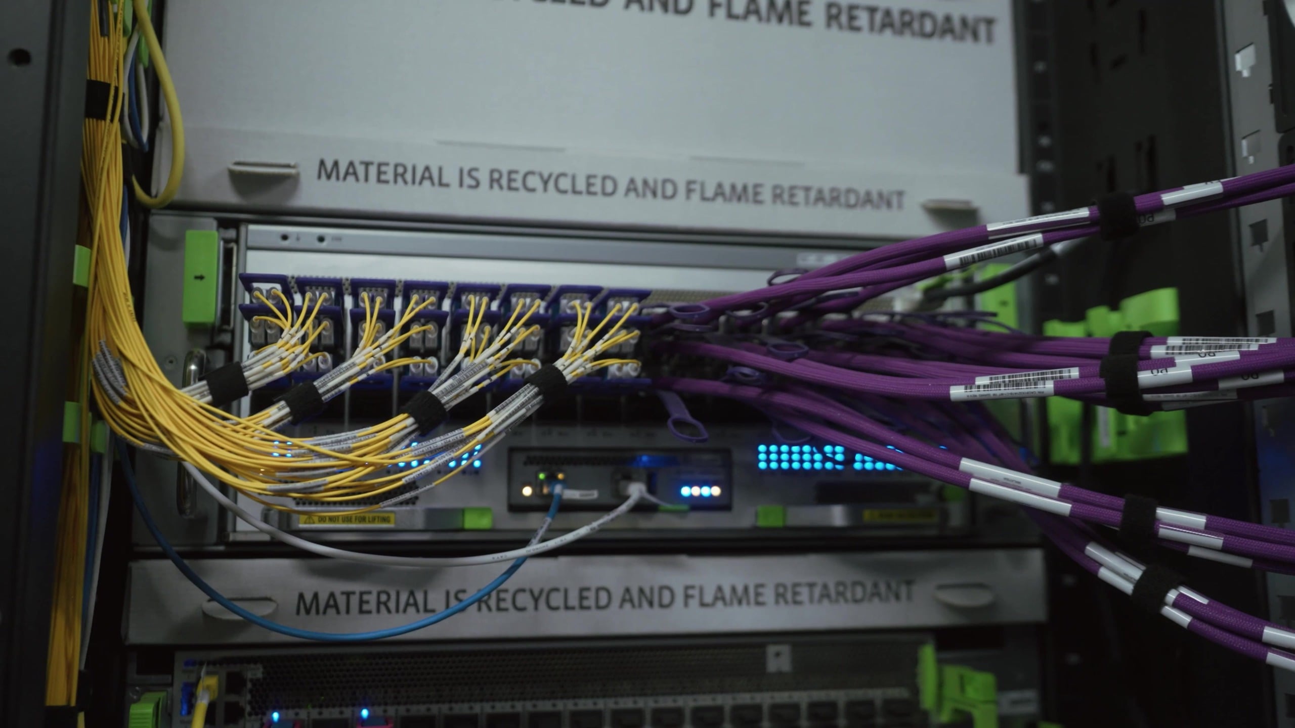 Close-up of a Meta Prometheus switch with yellow fiber and purple cable bundles