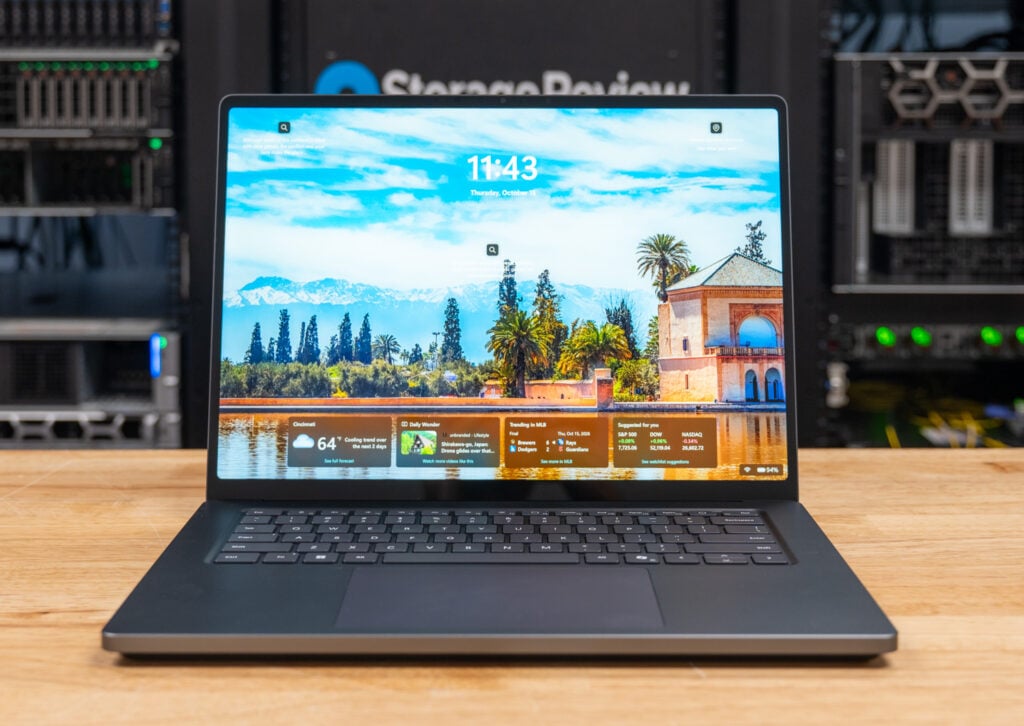 Microsoft Surface Laptop Ultra for Business open on the StorageReview lab bench with the display on