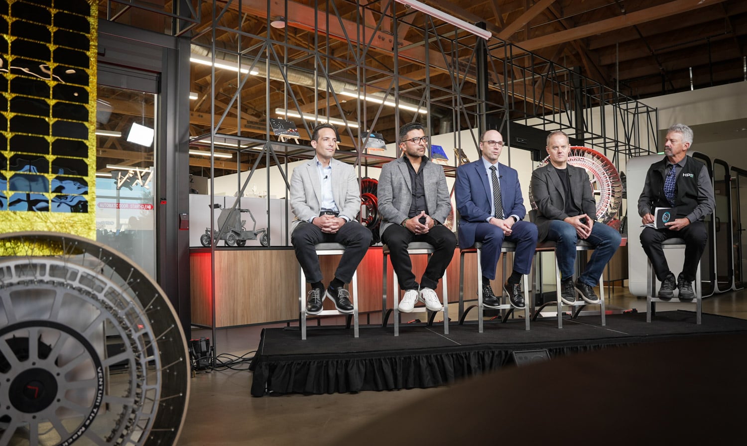 Panel at Astrolab with Francisco Cordova of the ISS National Laboratory, Faraz Velani of KIOXIA, Scott Wiest of HPE, and Astrolab CEO Jaret Matthews, moderated by Norm Follett of HPE, beside a mockup of the FLIP rover